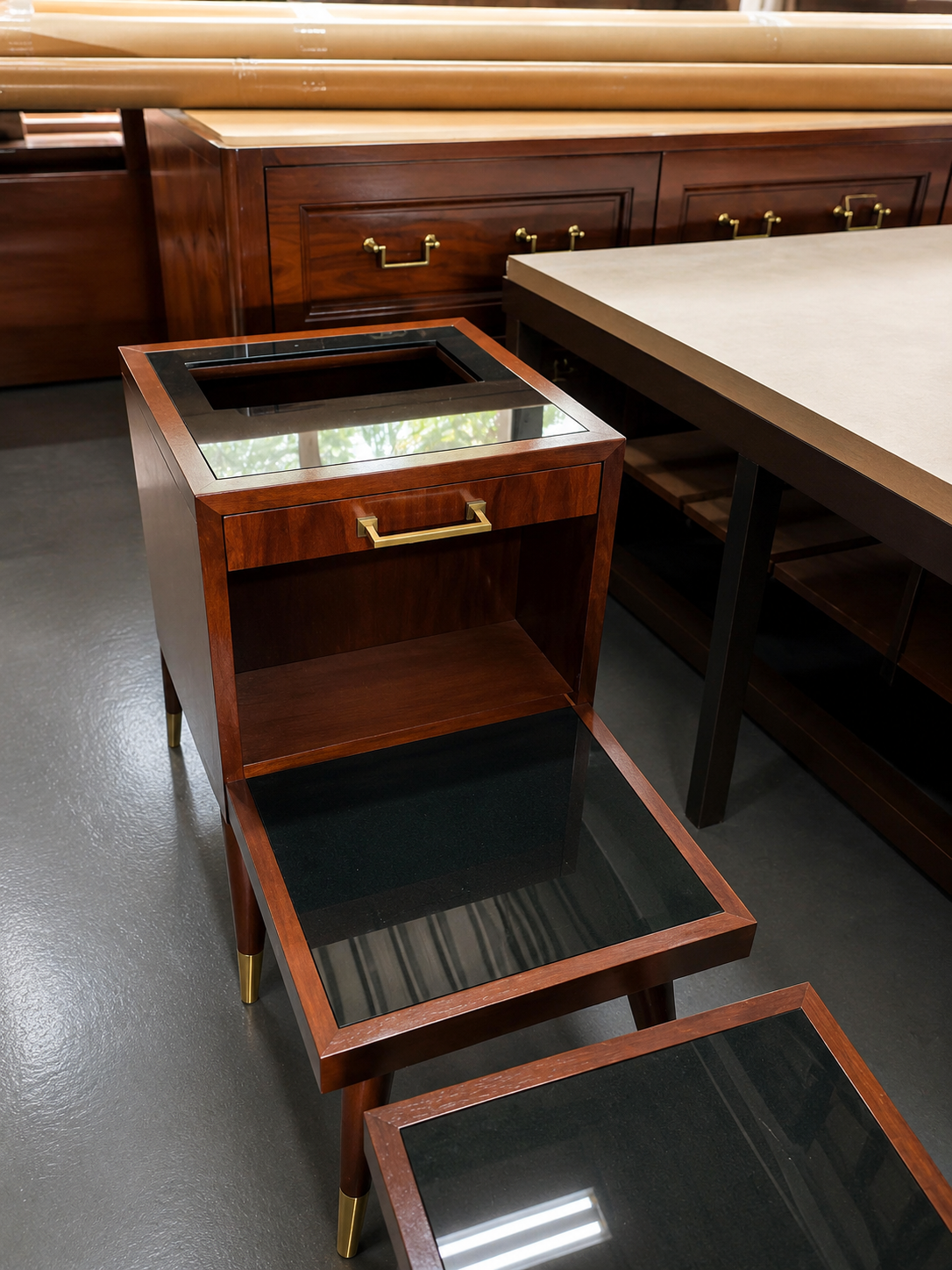 Bedside tables with mirrored glass inserts and custom brass hardware — workshop assembly